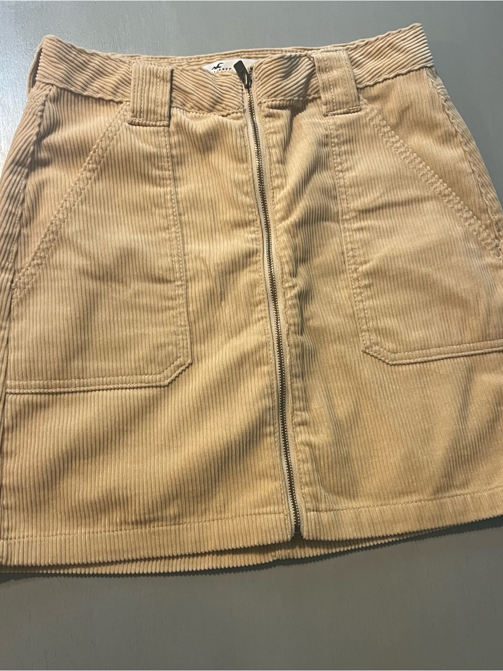 Corduroy Front-Zip Mini Skirt in Beige